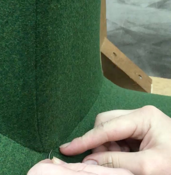 Bespoke hand stitching on Danish armchair wings