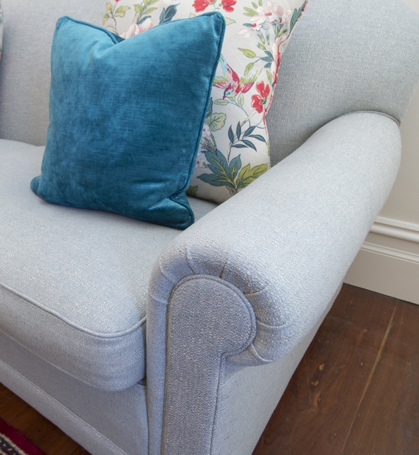 After - Accent cushions add a pop of personality while remaining tonally consistent with the room colour scheme