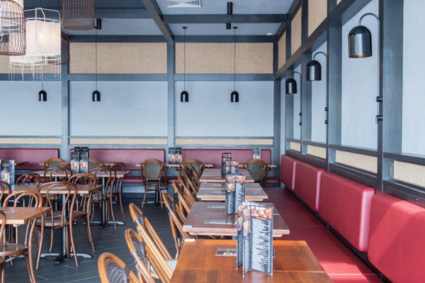 Booth seating around the perimeter of the restaurant is a clever way to use space